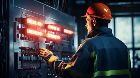 A technician working with a control panel in a gas distribution center.