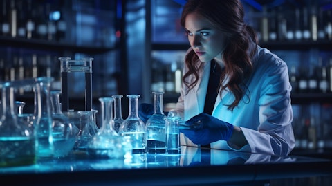 A laboratory technician carefully mixing chemicals in a laboratory.