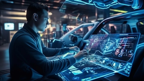 A technician connecting an automotive display in a modern car.