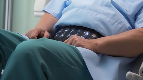 A patient in a medical office receiving a sacral neuromodulation treatment for their overactive bladder.