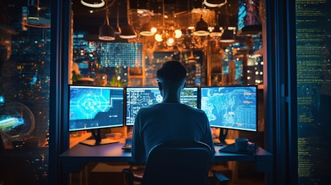 A software engineer coding while surrounded by the latest industry tools and technology.