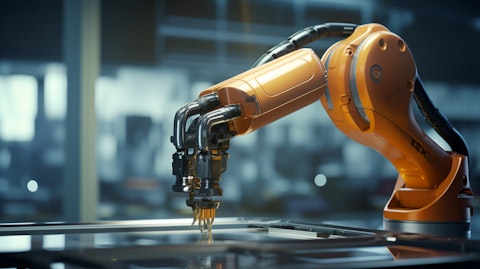 A close-up of a fuel pump operated by a robotic arm, symbolizing the company's technology-driven industrial solutions.