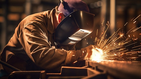 A close-up of a worker welding a steel product, showing the precision and craftsmanship.