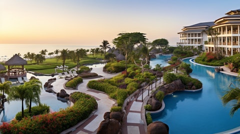 A wide panoramic shot of a scenic luxury hotel resort with its outdoor amenities.