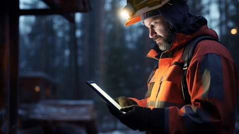 A worker at a remote location using Automated Application Technology with their tablet and scanner.