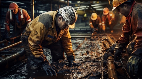 A crew of workers drilling down into the earth in search of new petroleum resources.