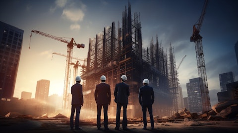 A team of architects and engineers standing in front of a mid-construction commercial building.