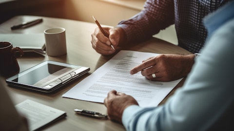 A doctor and patient discussing an insurance policy with an insurance underwriter.