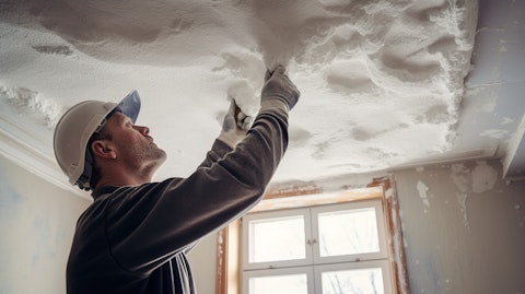 A skilled craftsman installing a sophisticated mineral fiber ceiling.