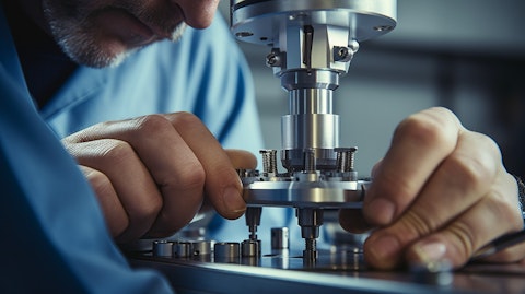 A close-up of a technician inspecting and testing a dispensing closure component.