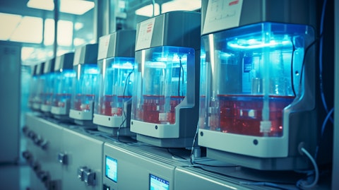 A row of automated plasma collection devices in a modern laboratory.