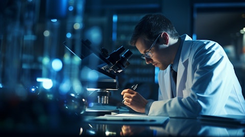 A molecular biologist, carefully studying the reagents under a microscope.