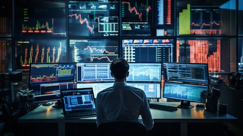 A trader in a busy trading room, surrounded by real-time market data and automated execution services.