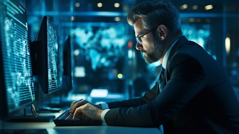 A tech expert at their workplace, immersed in scrutinizing a Cyber exposure solution.