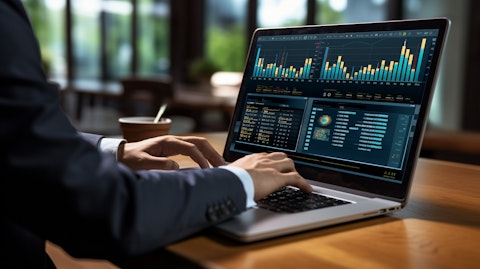 A finance professional at their computer logging into the company's branded digital banking platform.