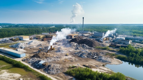 Aerial shot of a recycling plant and its surrounding environment, highlighting the company's commitment to environmental sustainability.