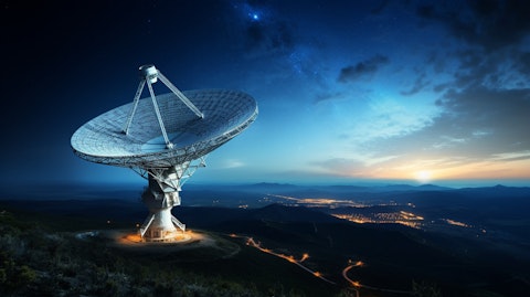 A satellite dish with a view to the night sky, preparing to receive transmissions.