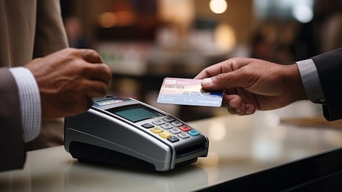 A side profile of a consumer within a store handing a credit card to a cashier, reflecting the debt collection services of the company.