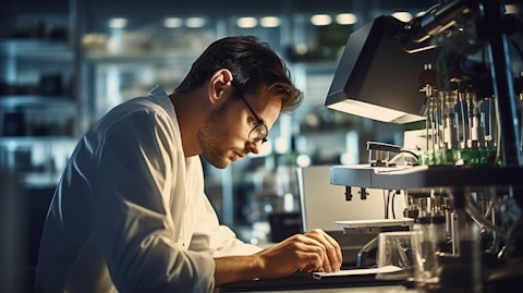 A technician checking a calibration tool in a laboratory environment.