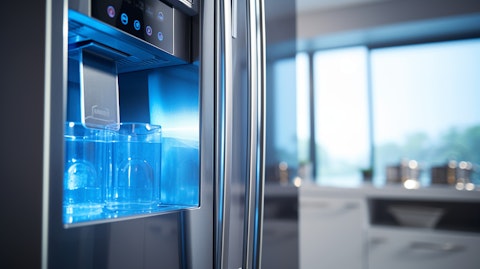 A close-up of a modern refrigerator with the company logo in the background.