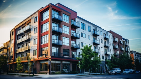An exterior shot of a newly acquired apartment building, signifying the company’s acquisition of large residential properties.