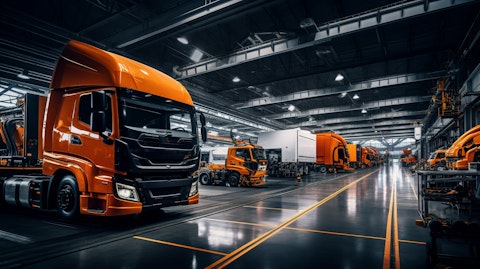 An assembly line of industrial vehicles, showcasing the company's technological prowess.