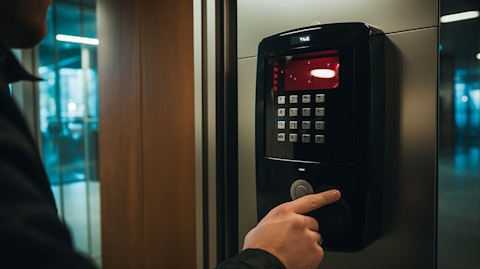 An electronic security product being installed in a high-tech building.