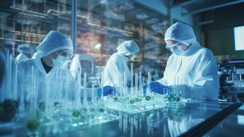 A biopharmaceutical laboratory with research personnel in lab coats working on a breakthrough discovery.