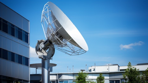 A satellite dish installation atop a modern building, symbolizing the power of signal transmission solutions.