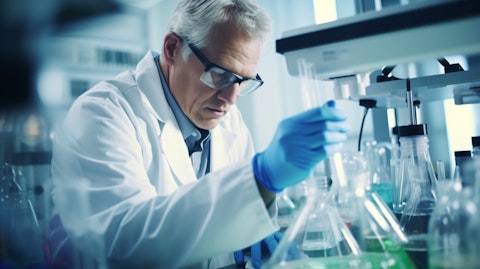 A laboratory chemist in a white lab coat analyzing samples of a potential new pharmaceutical.