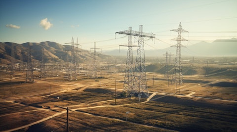 A wide aerial view of an electric power transmission facility with lines, substations, and overhead wires.