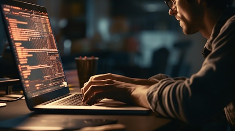 A close up of a software engineer typing on a laptop keyboard, focusing on the code development part of the company.