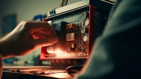 A close-up of a technician's hands installing a circuit protection device.