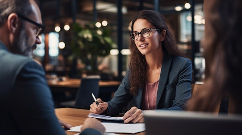 An HR specialist consulting with a business owner about employee benefits programs.