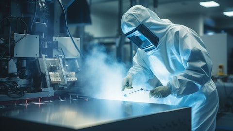 A worker in a cleanroom laboratory environment, performing gamma and electron beam irradiation for medical devices.