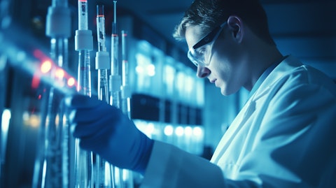 An image of a research technician wearing lab coat with a syringe full of biopharmaceuticals.