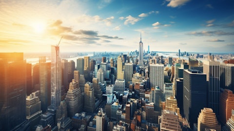 Aerial view of a city skyline, with many buildings owned by the real estate arm of the company.