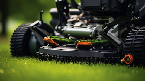 A close up of a golf course mower, showcasing the intricate precision of its components.