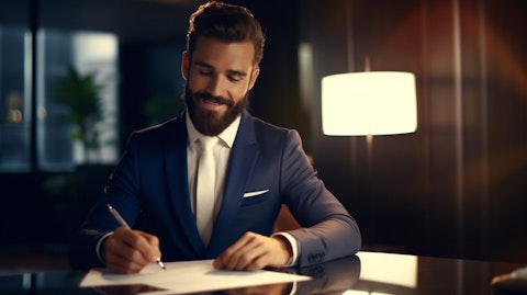A businessman signing a loan contract with a satisfied smile.