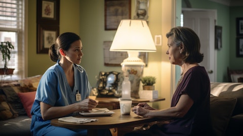 A doctor in scrubs interacting with a Medicare Advantage member in her home.