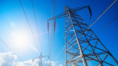 A close-up of an electrical power line with a bright blue sky in the background, highlighting the company's selection of electricity and natural gas services.