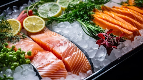 A close-up of fresh frozen vegetables and fish products ready for packaging.