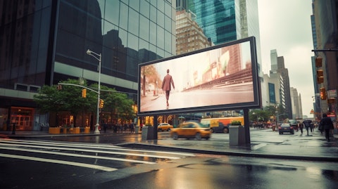 A digital billboard on a bustling street corner, showing the modern way of advertising.