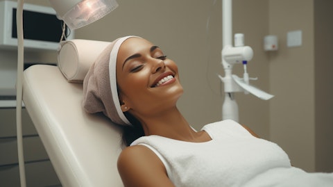 A patient in a medical aesthetics clinic smiling joyfully, showing the temporary improvement in appearance from the botulinum toxin type A formulation.