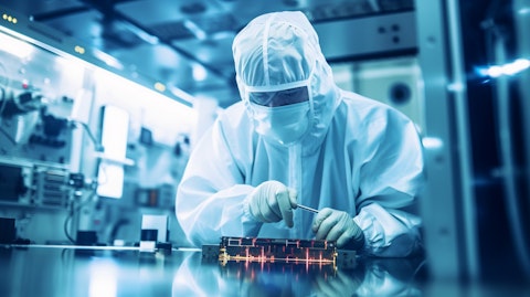 A technician inspecting a newly-manufactured semiconductor product.