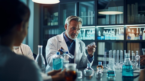 A biopharma executive in a meeting room discussing the clinical-stage of a new therapy.