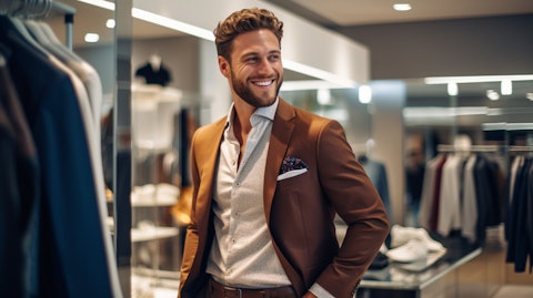 A well-dressed customer smiling while trying on a fashionable outfit in a modern retail store.