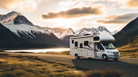 A motorhome parked in view of a mountain range, reflecting the joy of the open road.