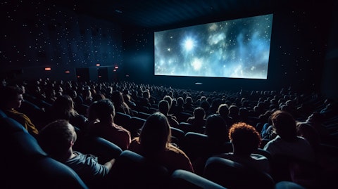 An audience gathered in an IMAX theater, enjoying the cinematic experience.