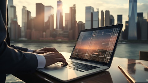 A close up of a laptop with a silhouette of a financial analyst and the city skyline in the background.